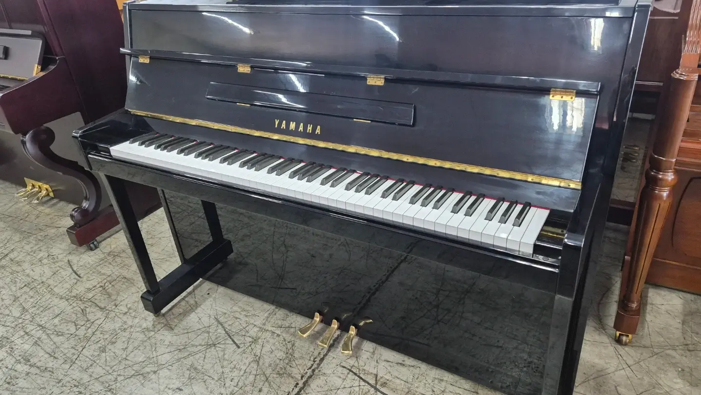 Japanese-made black upright piano