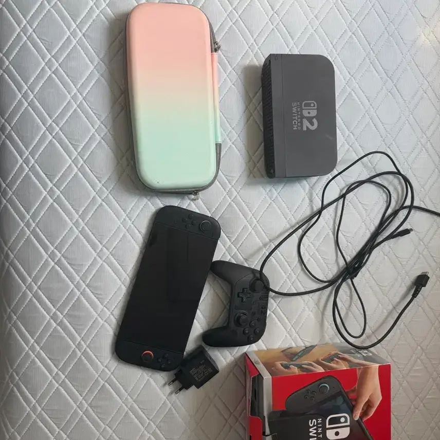 Selling Nintendo Switch 2 console, Japan-exclusive pouch, and full box.