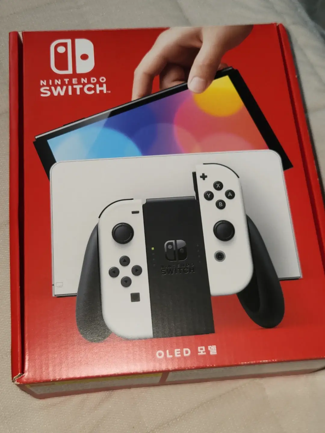 Máy chơi game Nintendo Switch OLED màu trắng, hộp đầy đủ, kèm thẻ nhớ Micro SD 128GB.